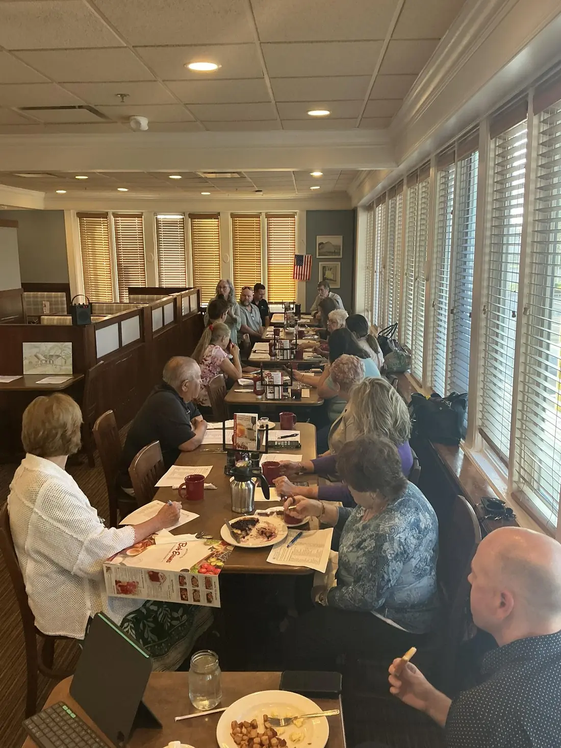 TPBG members enjoying breakfast and conversation along the long table