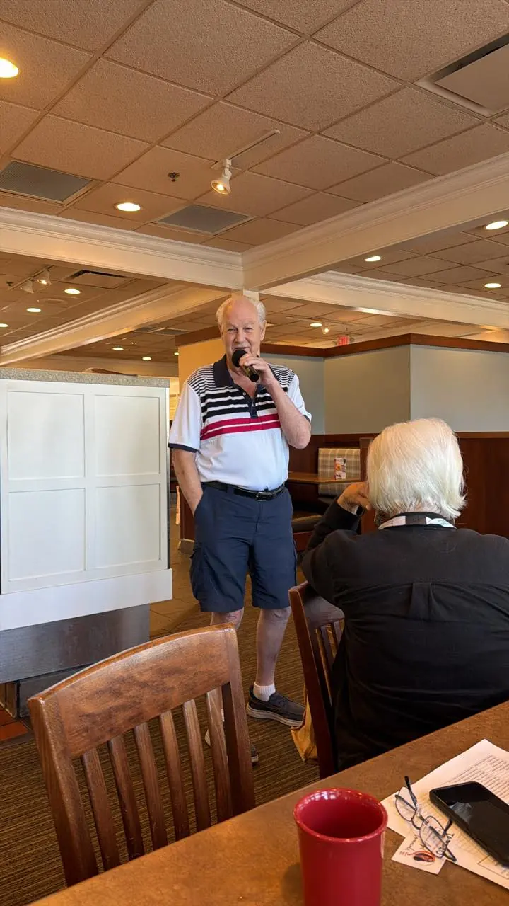 A guest speaker at the front of the room