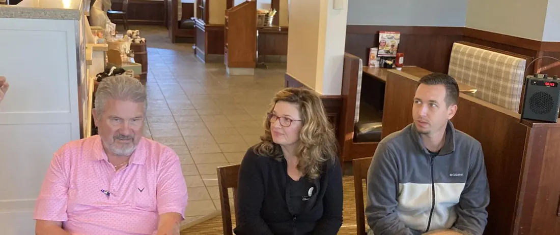 Members listening attentively during a presentation