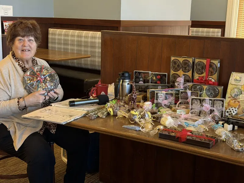Member showcasing her handmade chocolates business