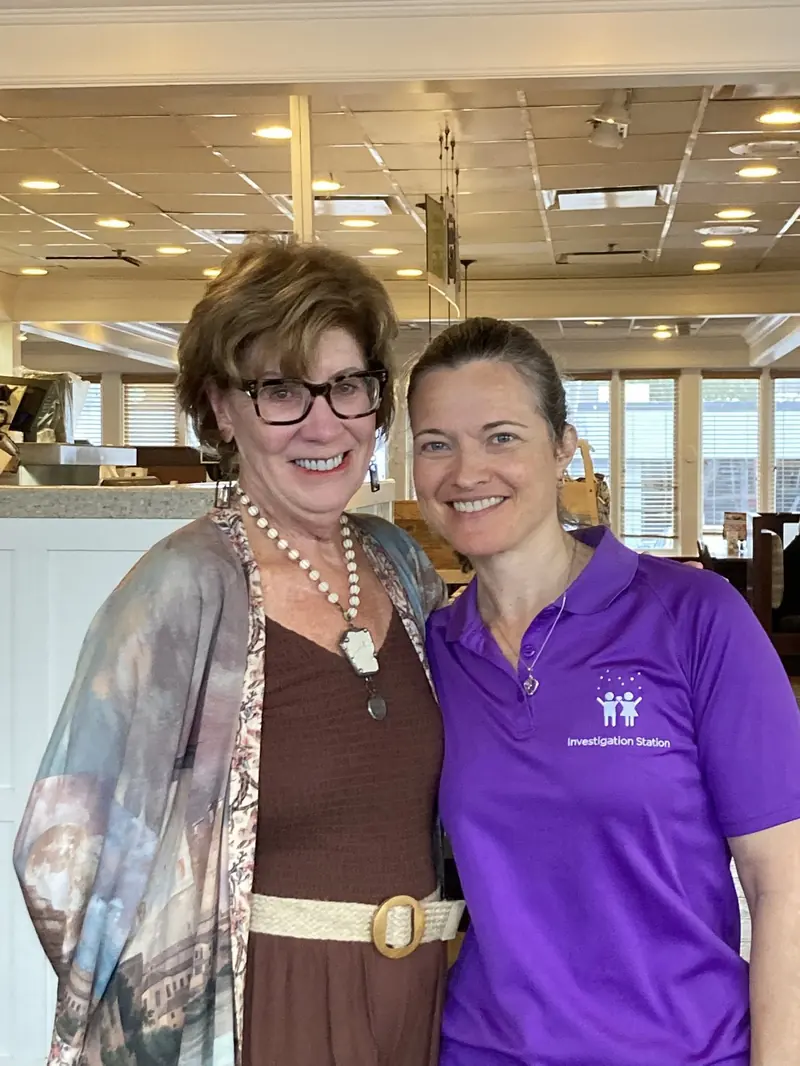 Two TPBG members connecting before a meeting